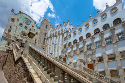 Low angle view of buildings in city against sky