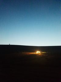 Scenic view of silhouette landscape against clear sky during sunset