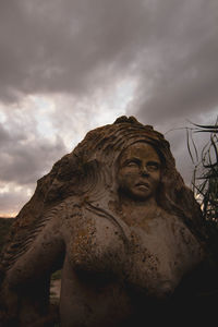 Low angle view of statue against sky