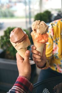 Man holding ice cream cone