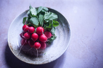 High angle view of strawberries in bowl on table