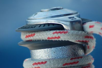 Close-up of coin operated binoculars against blue background