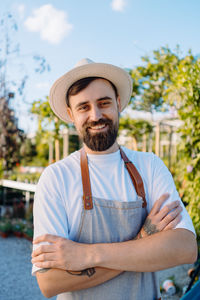 Portrait of young man wearing hat standing outdoors