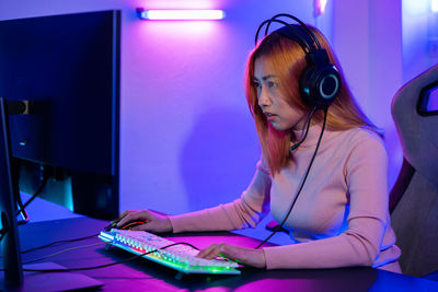 Young woman using laptop at home