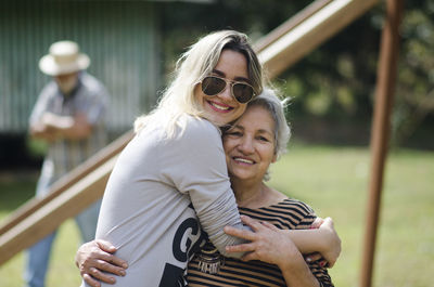 Portrait of smiling women in park