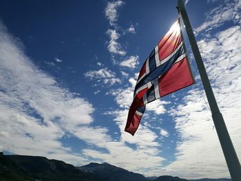 Low angle view of flag against sky