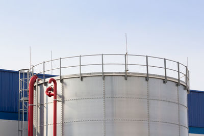 Low angle view of factory against clear sky