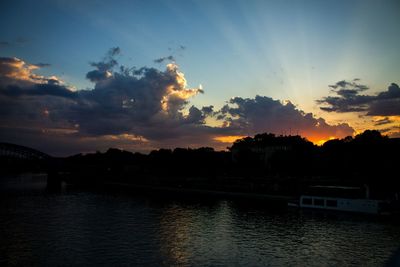 Scenic view of river at sunset