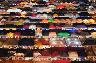 High angle view of illuminated market stalls at night