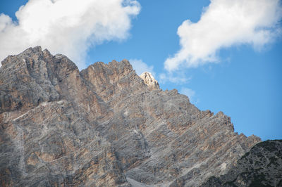 Low angle view of rock formations against sky