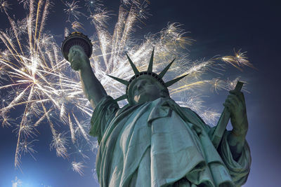 Low angle view of statue against sky