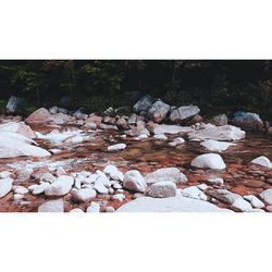 Rocks on beach during winter