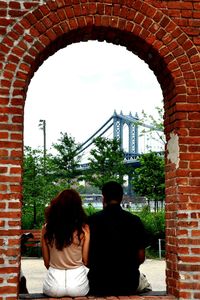 People in front of built structure