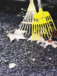 High angle view of yellow umbrella on street