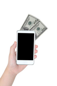 Close-up of hand holding smart phone over white background