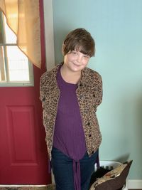 Portrait of smiling girl standing at home