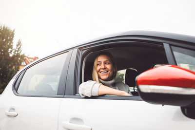 Side view of woman in car