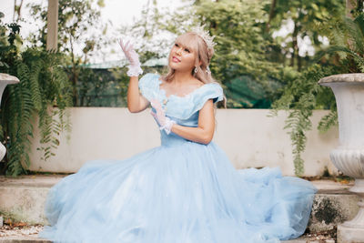 Full length of woman wearing dress standing outdoors