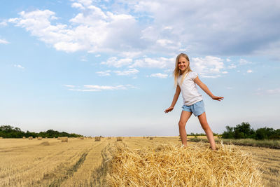 Full length of woman on field against sky