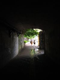 People walking in tunnel