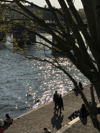 Men in water against sky