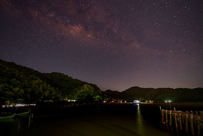 Scenic view of lake against star field at night