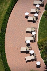 High angle view of shopping cart on field by building