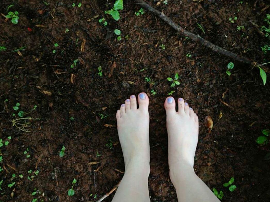 low section, person, personal perspective, human foot, lifestyles, leisure activity, high angle view, grass, barefoot, standing, part of, field, shoe, unrecognizable person, outdoors, day