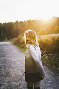 Woman standing on road