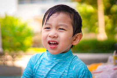 Portrait of a young boy with emotion face on blurred background. emotion concept.