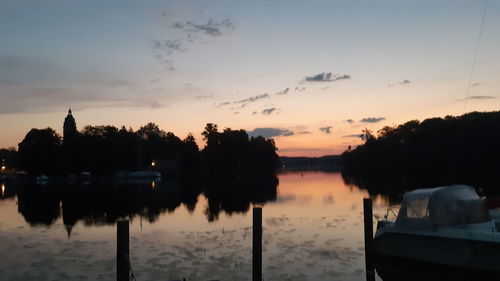 Scenic view of lake against sky during sunset