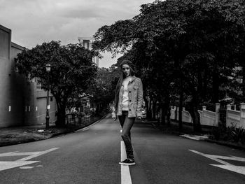 Rear view of woman walking on street