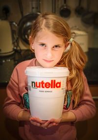 Portrait of a smiling girl holding ice cream