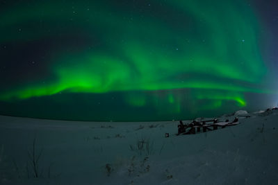 Scenic view of snow against sky at night during winter