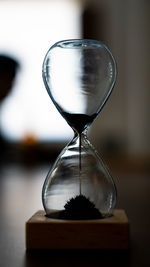 Close-up of hourglass on table