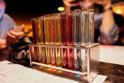 Close-up of wine glasses on table