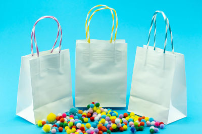 Close-up of candies on table against blue background