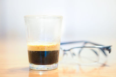 Close-up of beer glass on table