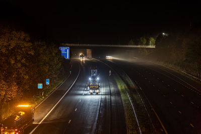 High angle view of light trails on road at night