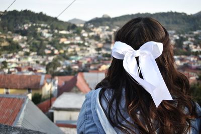 Rear view of woman wearing ribbon