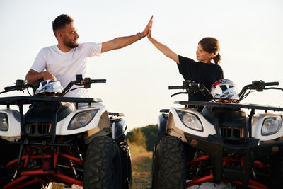 Rear view of man riding motorcycle