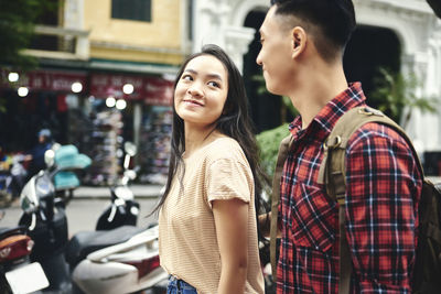 Young couple smiling in city