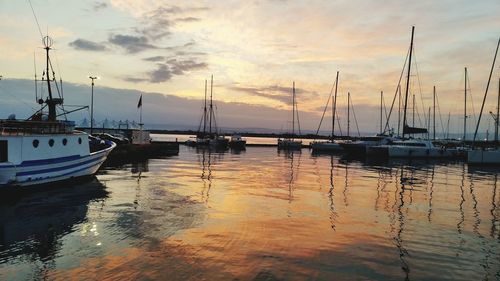 Boats moored at harbor