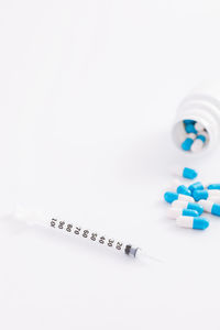 Close-up of pills on white background