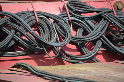 Tangled wires on red metal