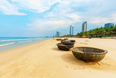 View of beach against cloudy sky