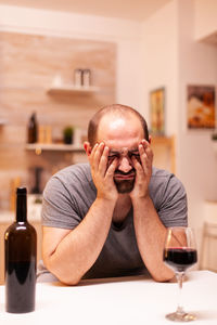 Portrait of woman drinking glass