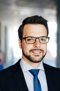 Portrait of businessman standing in office