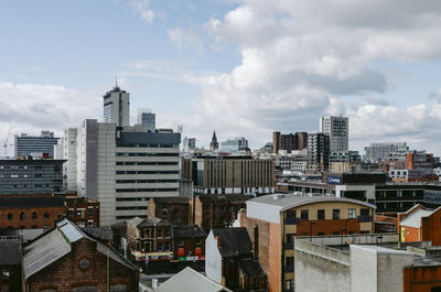 High angle view of buildings in city against sky