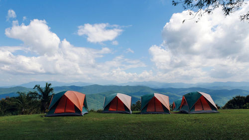 Tent on field against sky